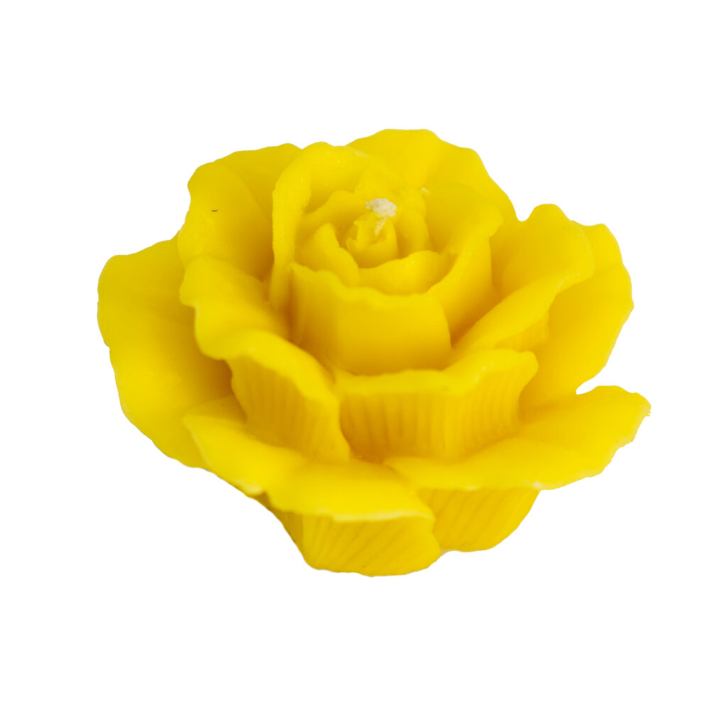żółta świeca w kształcie kwiatu róży